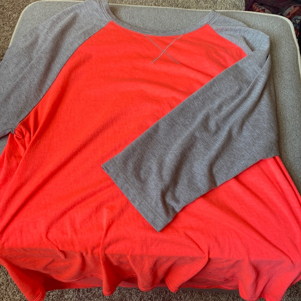Pink and gray athletic top. Quarter sleeve.